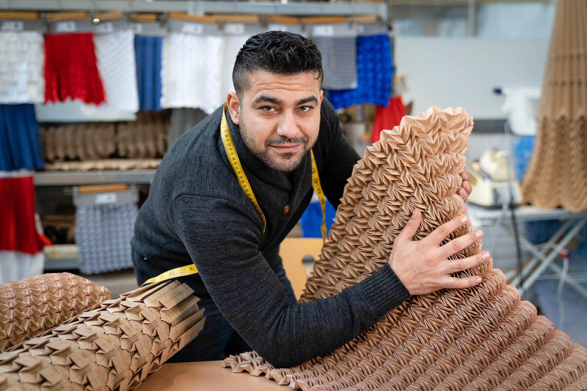 A Syrian maker portrayed with the tools of their practice