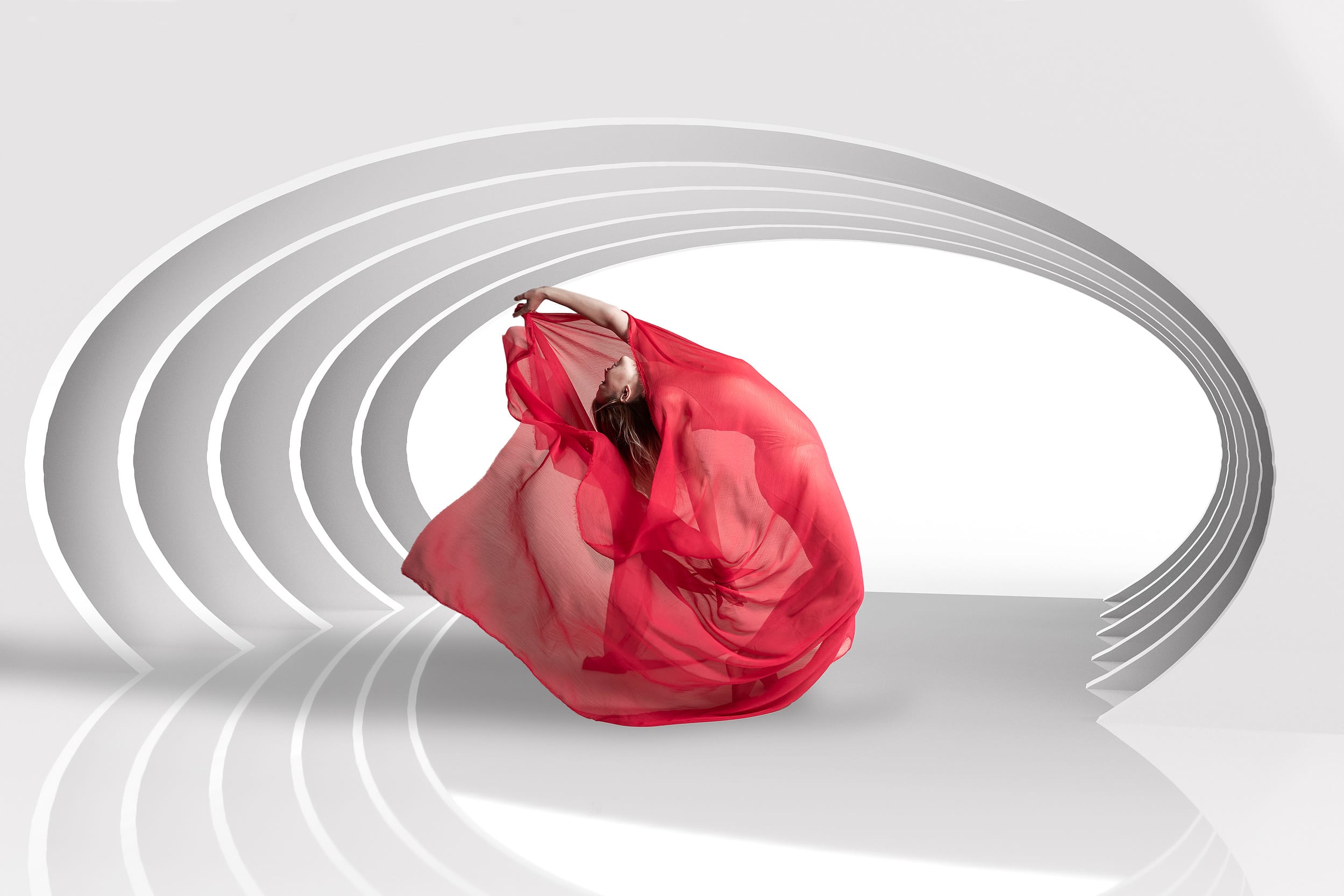 Figure and fabric arranged between white arcs