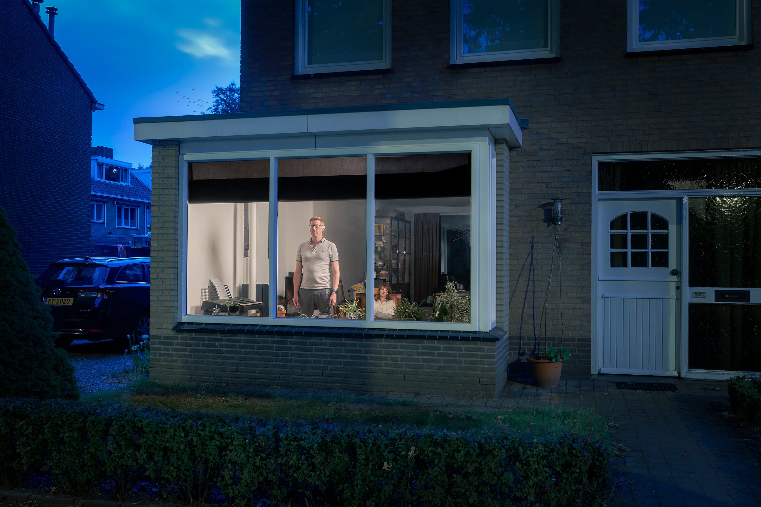 Ramon standing behind the window of his home during lockdown