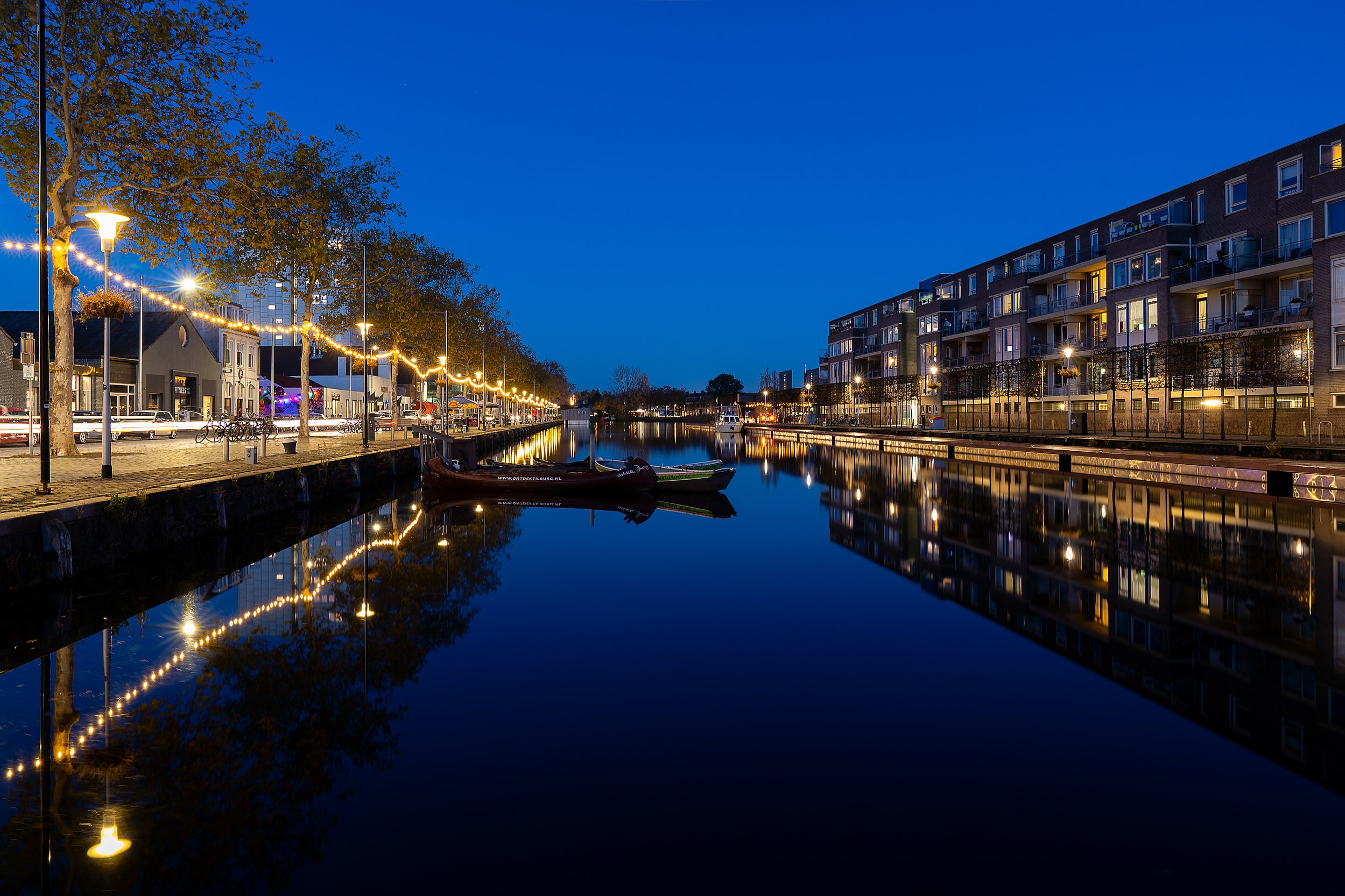 Piushaven in Tilburg at blue hour, reflected in still water